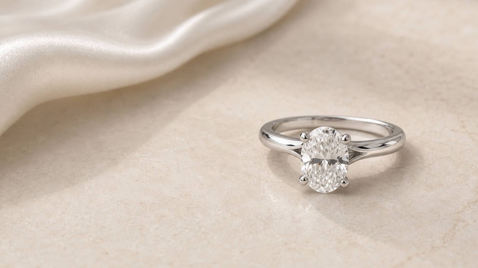 Estelle Oval Diamond Engagement Ring styled on a neutral surface for a lab-grown diamond education guide